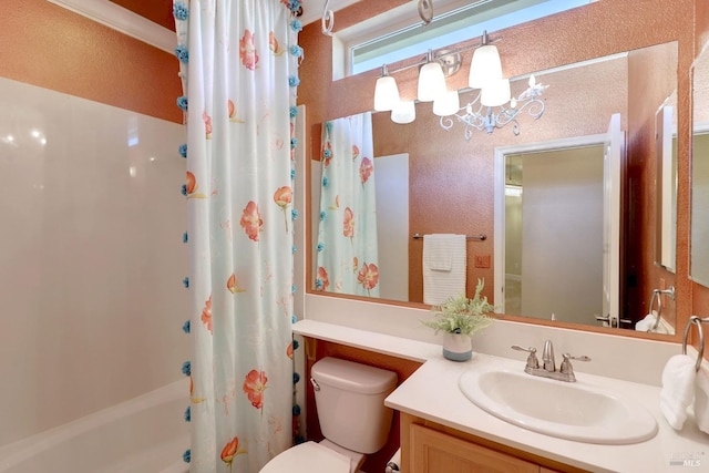 full bathroom featuring a chandelier, shower / tub combo, vanity, and toilet