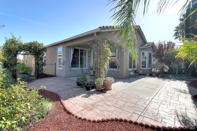 back of house featuring a patio