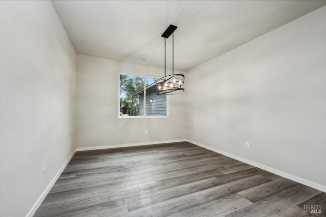 unfurnished dining area featuring dark hardwood / wood-style floors