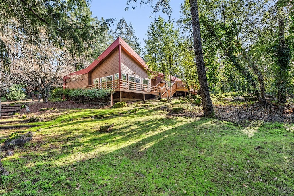 view of yard featuring a wooden deck