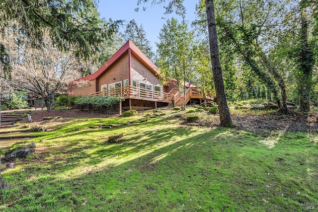 view of yard featuring a wooden deck