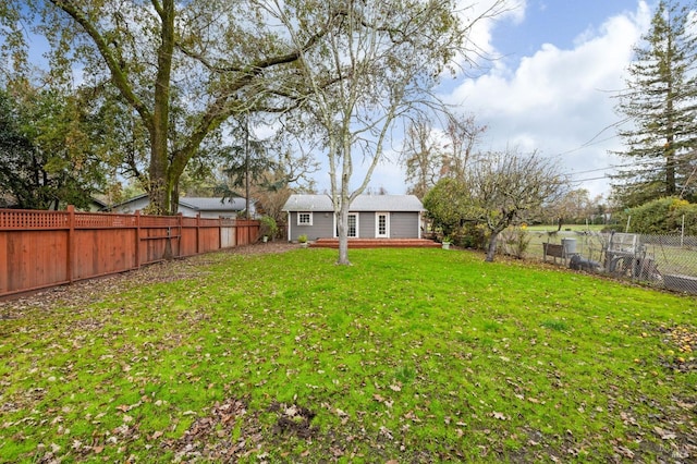 view of yard with a fenced backyard