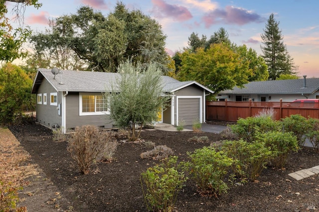 ranch-style house featuring crawl space, fence, and roof with shingles