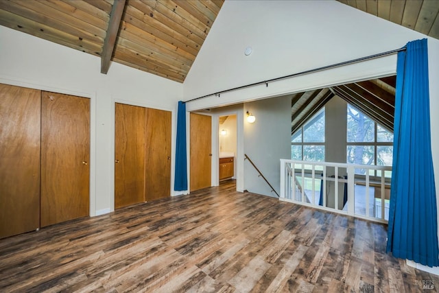 interior space featuring beamed ceiling, dark hardwood / wood-style floors, wood ceiling, and high vaulted ceiling