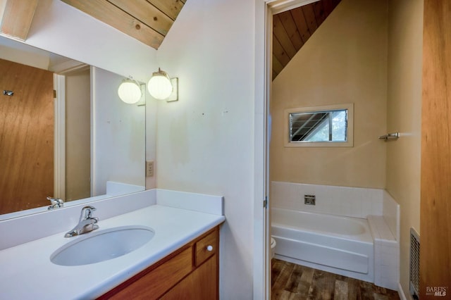 bathroom with a bathtub, wood ceiling, lofted ceiling, and wood-type flooring