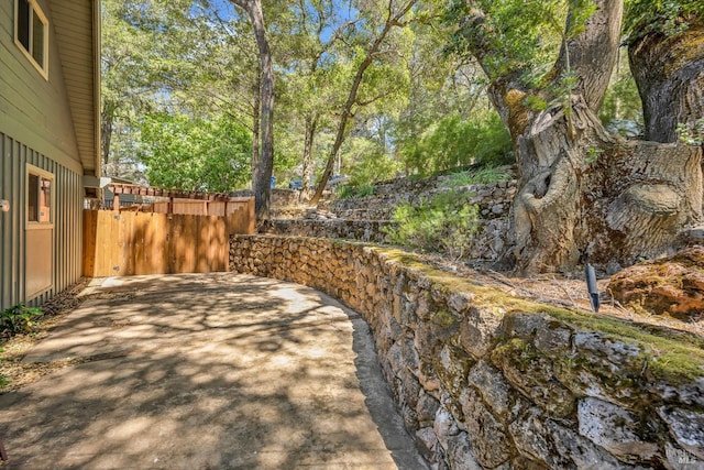 view of yard featuring a patio and fence