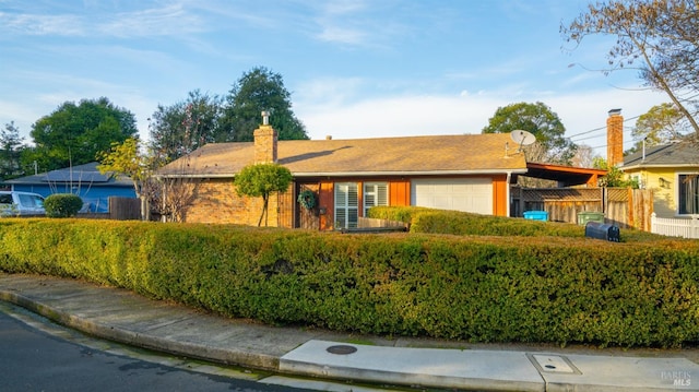 ranch-style house featuring a garage