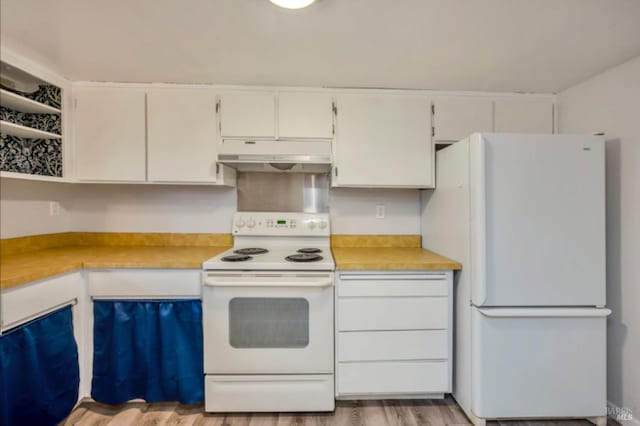 kitchen with white cabinetry, light wood-type flooring, and white appliances