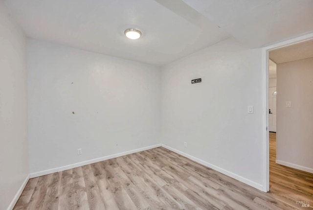 spare room featuring light hardwood / wood-style floors