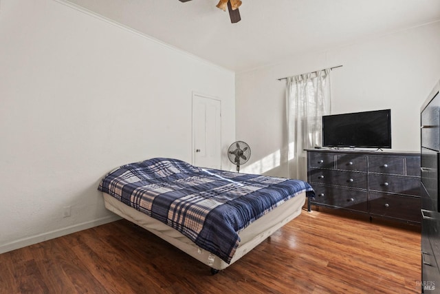 bedroom featuring ceiling fan and wood-type flooring