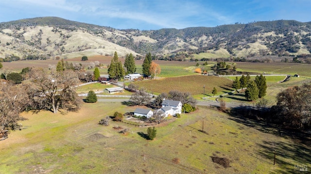 birds eye view of property featuring a mountain view and a rural view