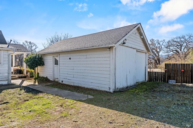 garage featuring a lawn