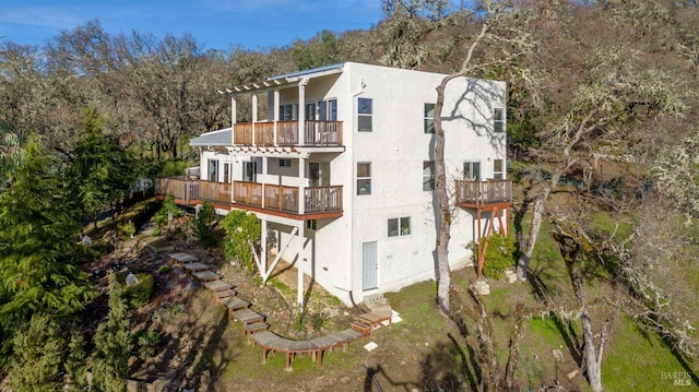 view of home's exterior with a balcony