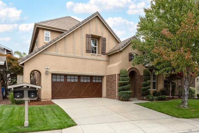 view of front facade featuring a front yard and a garage