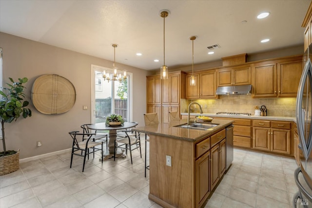 20 Oak Grove Dr, Novato, CA 94949 - kitchen with a sink, brown cabinetry, under cabinet range hood, and appliances with stainless steel finishes