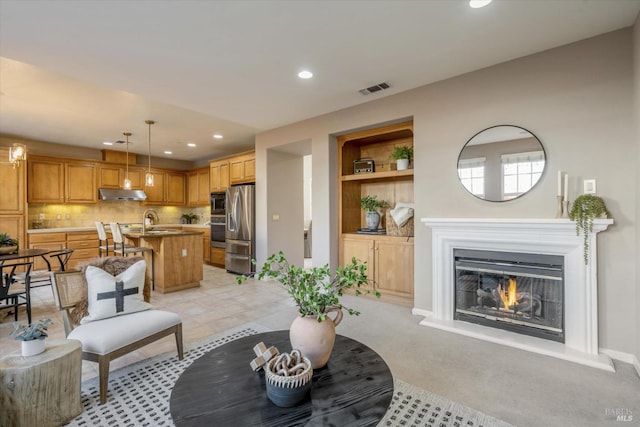 20 Oak Grove Dr, Novato, CA 94949 - living area featuring visible vents, baseboards, built in shelves, recessed lighting, and a glass covered fireplace