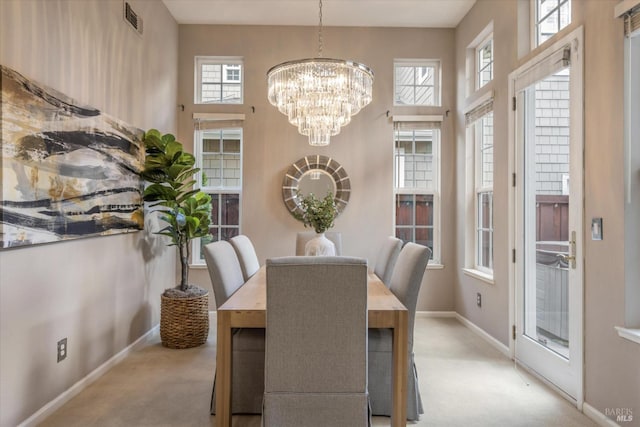 20 Oak Grove Dr, Novato, CA 94949 - carpeted dining space featuring visible vents, a notable chandelier, baseboards, and a wealth of natural light