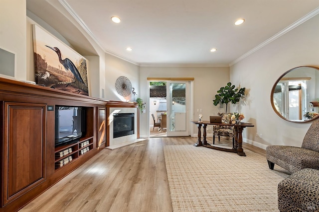 sitting room featuring crown molding and hardwood / wood-style floors