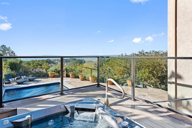 balcony featuring a jacuzzi