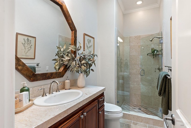 bathroom with toilet, vanity, crown molding, and walk in shower