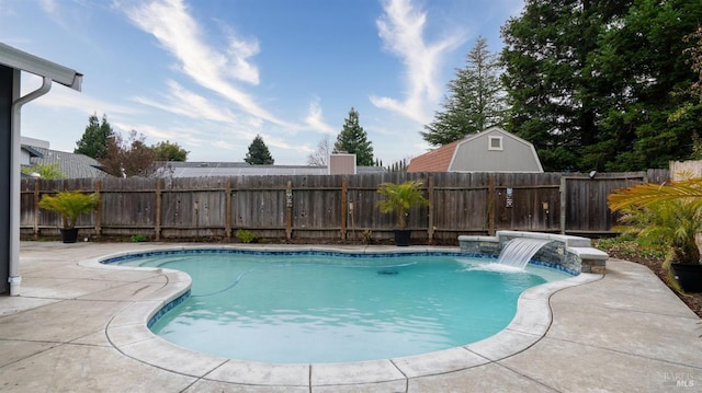 view of pool featuring pool water feature and a patio area