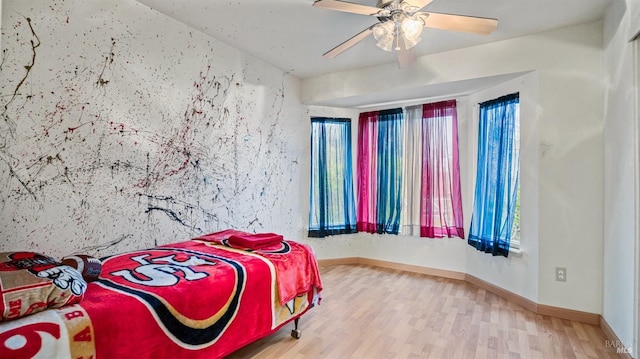 bedroom with hardwood / wood-style floors and ceiling fan