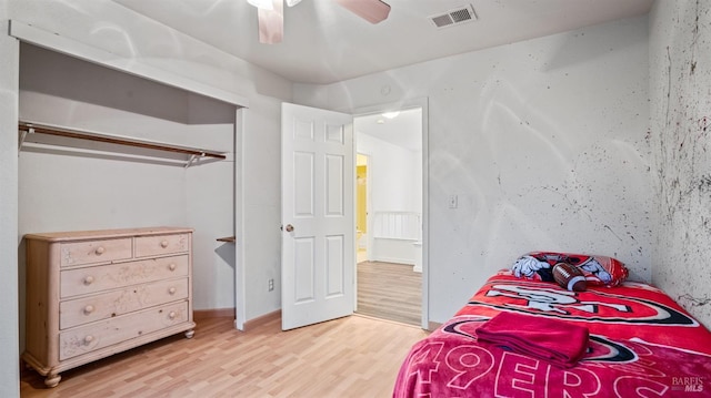 bedroom featuring wood-type flooring and ceiling fan