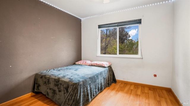 bedroom featuring wood-type flooring