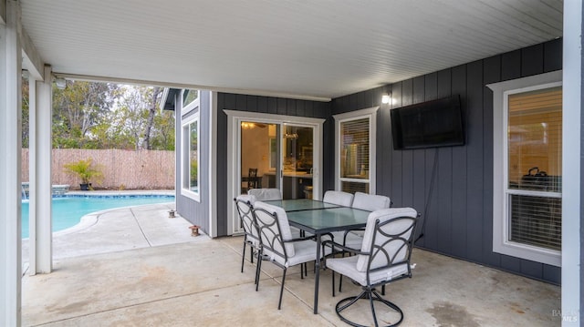 view of patio / terrace with a fenced in pool