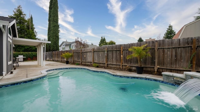 view of pool featuring a patio area and pool water feature