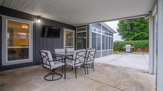 view of patio / terrace featuring area for grilling and a sunroom