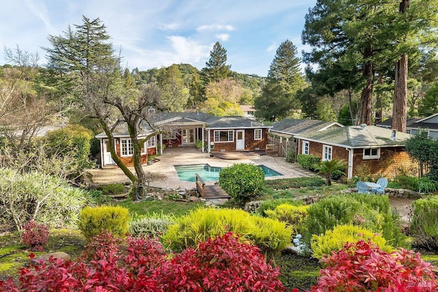 back of property featuring a patio area