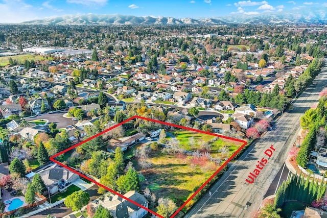 drone / aerial view featuring a mountain view