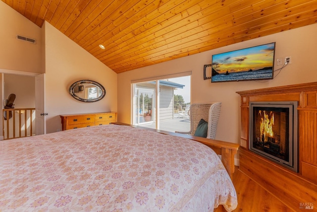 bedroom with a warm lit fireplace, wooden ceiling, visible vents, vaulted ceiling, and access to outside