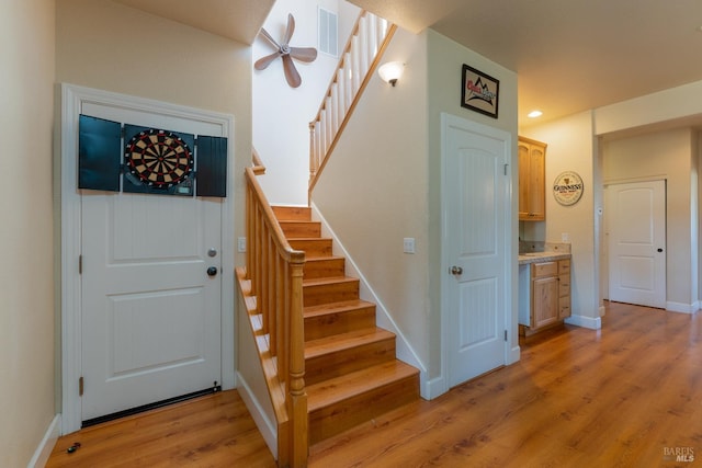 stairway with wood-type flooring