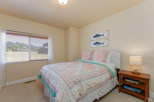 bedroom featuring carpet, visible vents, and baseboards