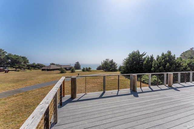 wooden terrace with a yard