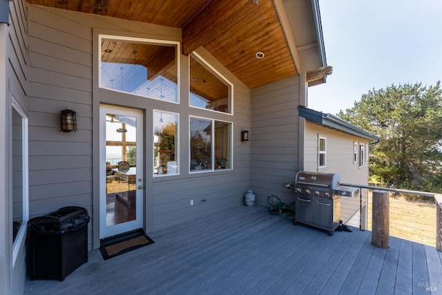 wooden terrace featuring grilling area