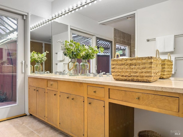 bathroom with tile patterned floors and vanity