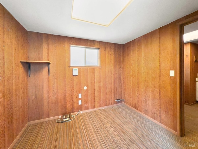 laundry room featuring wood walls