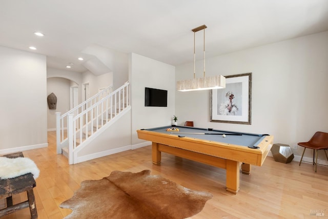 game room with hardwood / wood-style flooring and pool table