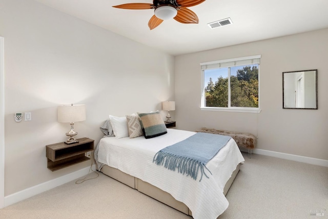 bedroom featuring ceiling fan and light carpet