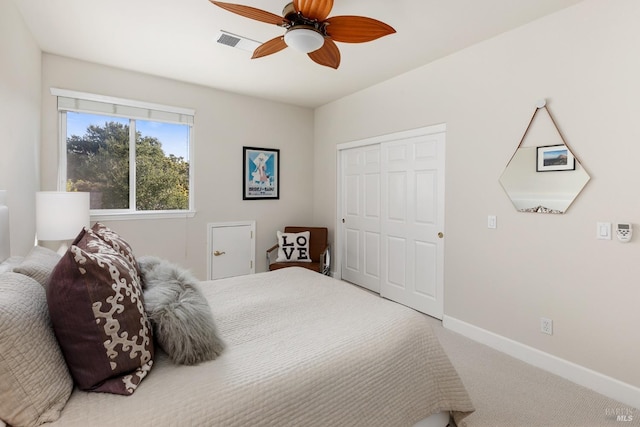 bedroom with carpet, ceiling fan, and a closet