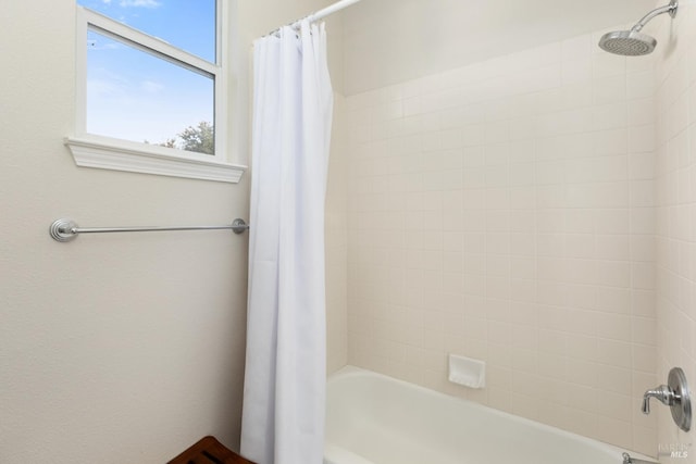 bathroom with shower / tub combo