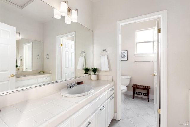 bathroom with tile patterned flooring, vanity, and toilet