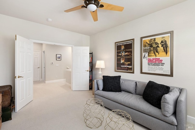 living room with ceiling fan and light colored carpet