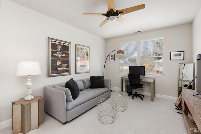 office area featuring ceiling fan and light colored carpet