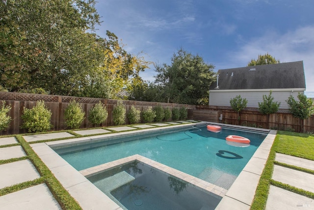 view of pool with an in ground hot tub