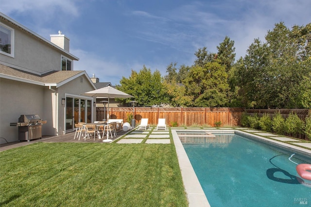 view of swimming pool with a lawn, a patio area, and a grill