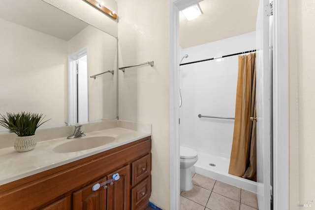 bathroom featuring tile patterned flooring, vanity, a shower with curtain, and toilet